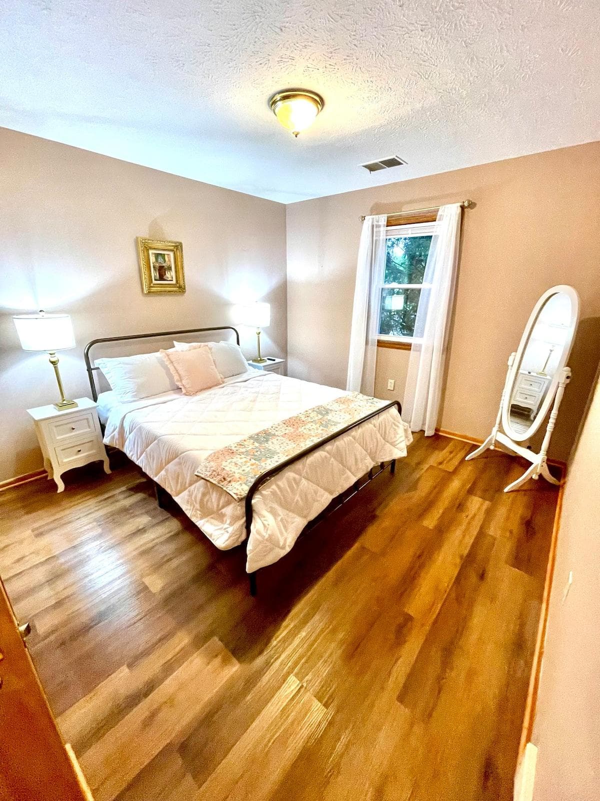 Beautiful, cozy master bedroom. Has its own TV